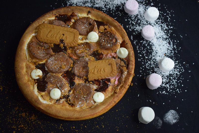 Dessert pizza with Lotus biscuits, chocolate and marshmallows